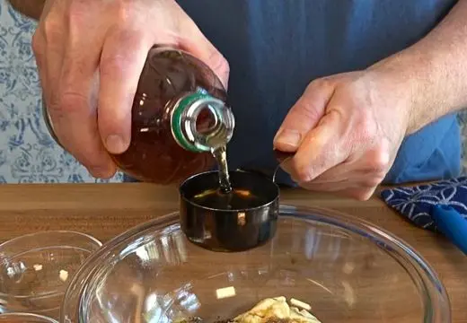 Pouring Apple Cider Vinegar Into Sauce Base